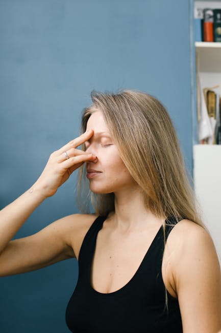 Woman in a peaceful yoga pose inside a warm, softly lit living room